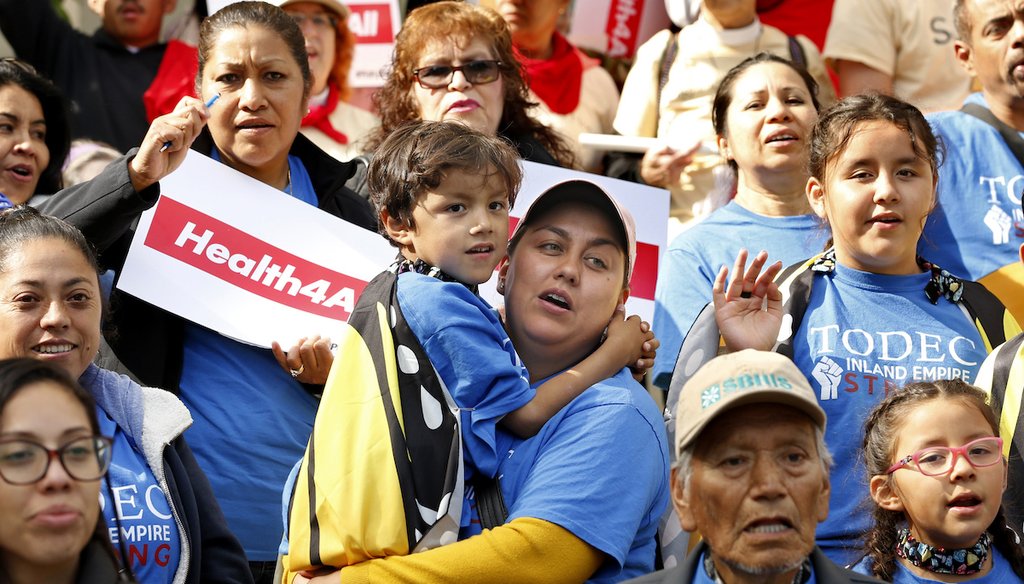 Immigrants Day of Action rally, in Sacramento, Calif. Gov. Gavin Newsom's first budget, signed in June, lets immigrants at age 25 and under living in the country illegally sign up for Medicaid benefits if they meet income requirements. May 20, 2019. (AP)
